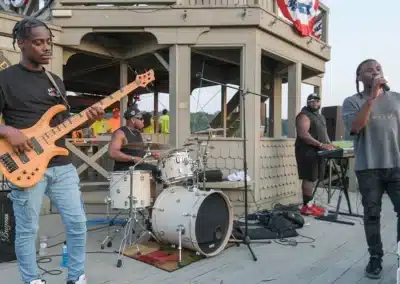 Musicians playing during a social event at Great Meadow