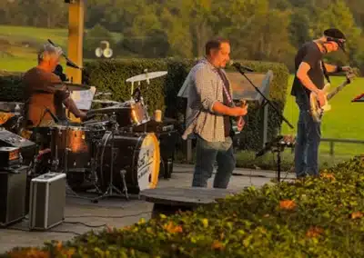 Musicians playing at social event at Great Meadow
